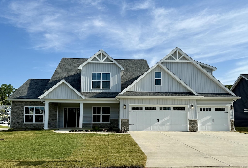 3499 Durrington Ct, West Lafayette, IN 47906 - craftsman inspired home featuring concrete driveway, board and batten siding, stone siding, a garage, and a front yard