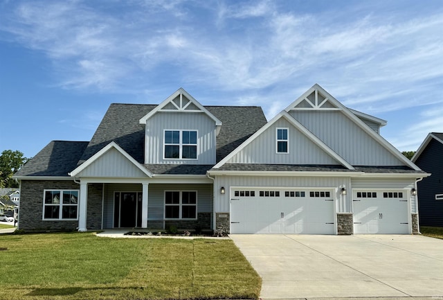 3499 Durrington Ct, West Lafayette, IN 47906 - craftsman inspired home featuring concrete driveway, board and batten siding, stone siding, a garage, and a front yard