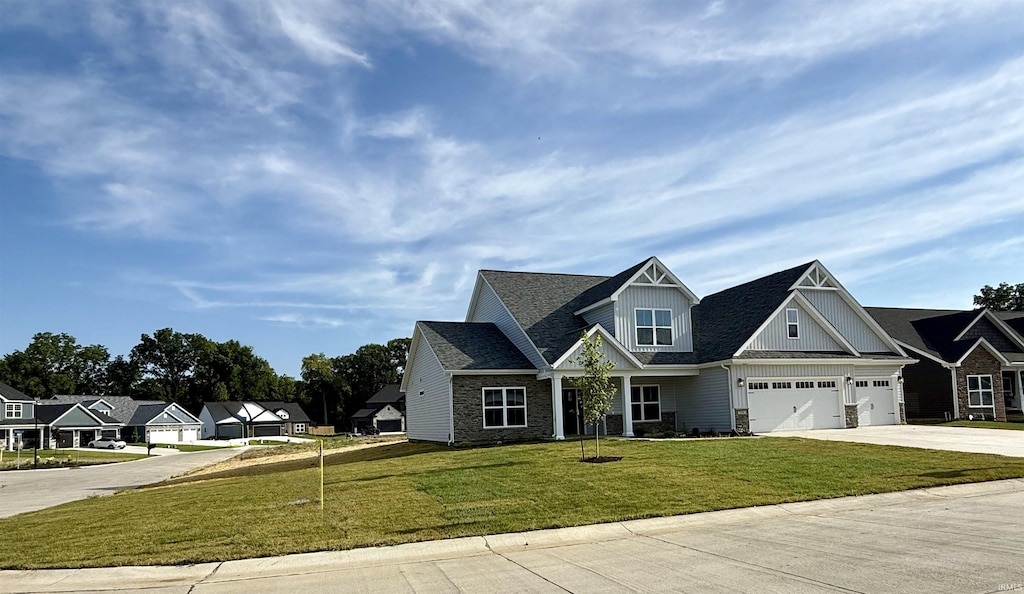 3499 Durrington Ct, West Lafayette, IN 47906 - craftsman-style house featuring concrete driveway, a garage, a front yard, board and batten siding, and a residential view