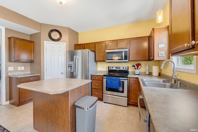 1823 Apopka Way, Fort Wayne, IN 46814 - kitchen featuring stainless steel appliances, brown cabinetry, light countertops, and a center island