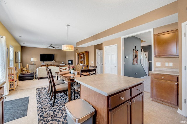 1823 Apopka Way, Fort Wayne, IN 46814 - kitchen with ceiling fan, a kitchen island, light countertops, and open floor plan