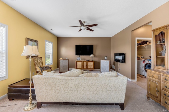 1823 Apopka Way, Fort Wayne, IN 46814 - living area with separate washer and dryer, light carpet, ceiling fan, and healthy amount of natural light