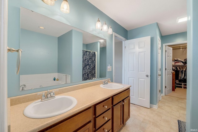 1823 Apopka Way, Fort Wayne, IN 46814 - bathroom featuring double vanity, a garden tub, a walk in closet, and a shower with shower curtain
