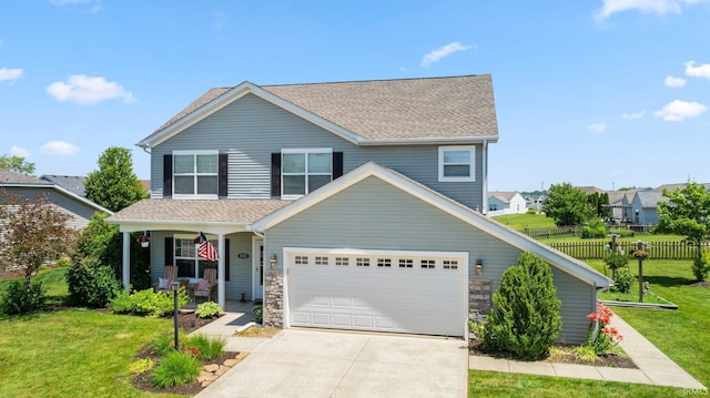 1823 Apopka Way, Fort Wayne, IN 46814 - traditional-style house featuring covered porch, driveway, a garage, and roof with shingles
