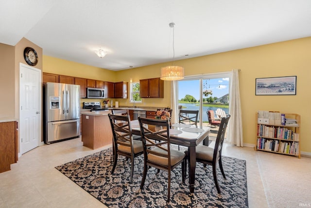 1823 Apopka Way, Fort Wayne, IN 46814 - dining room with a chandelier and a water view
