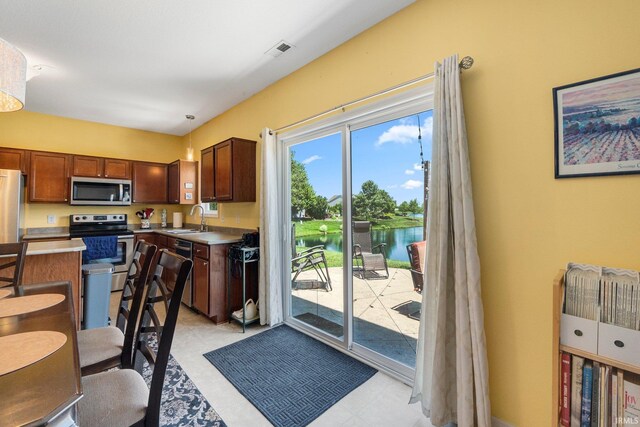 1823 Apopka Way, Fort Wayne, IN 46814 - kitchen with stainless steel appliances, a water view, light countertops, and light flooring