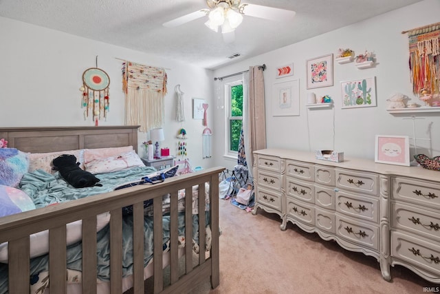 210 N Brookfield Dr, Lafayette, IN 47905 - bedroom with light carpet, a textured ceiling, and a ceiling fan