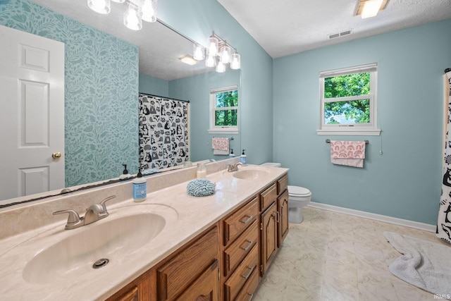 210 N Brookfield Dr, Lafayette, IN 47905 - bathroom with double vanity, healthy amount of natural light, a shower with shower curtain, and a textured ceiling