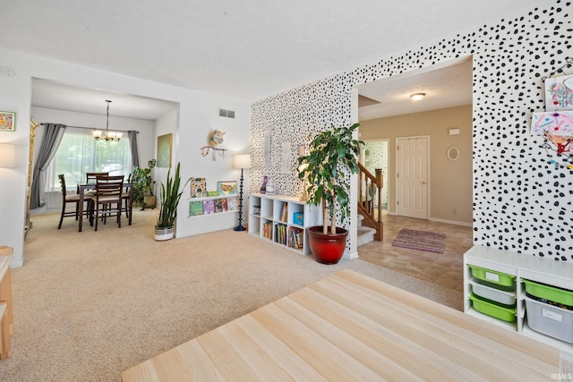 210 N Brookfield Dr, Lafayette, IN 47905 - living area with stairway, a chandelier, carpet floors, and a textured ceiling
