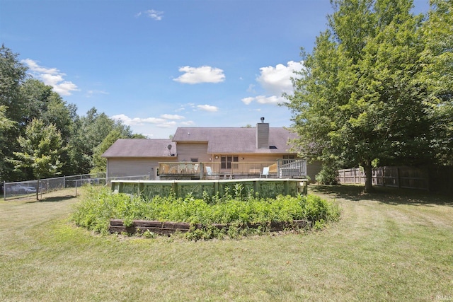 5171 N 350 E, Rolling Prairie, IN 46371 - rear view of property featuring a chimney and a deck