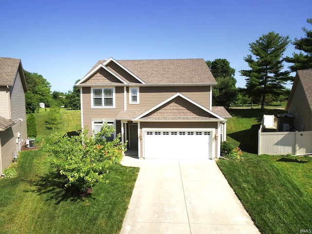 1860 Sandpiper Dr, West Lafayette, IN 47906 - view of front of house featuring driveway, a front yard, a garage, and roof with shingles