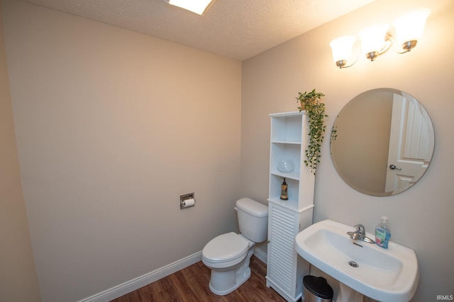 1860 Sandpiper Dr, West Lafayette, IN 47906 - half bathroom with wood finished floors and a textured ceiling