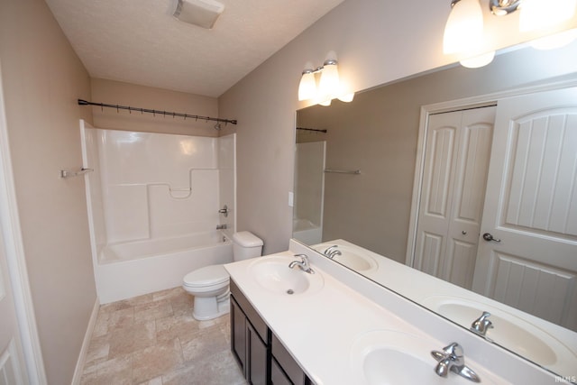 1860 Sandpiper Dr, West Lafayette, IN 47906 - bathroom with double vanity, bathing tub / shower combination, stone finish flooring, and a textured ceiling