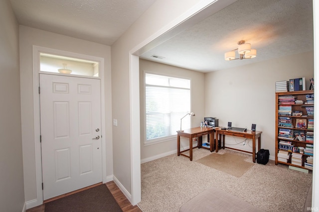 1860 Sandpiper Dr, West Lafayette, IN 47906 - foyer entrance with a textured ceiling, carpet, and a chandelier