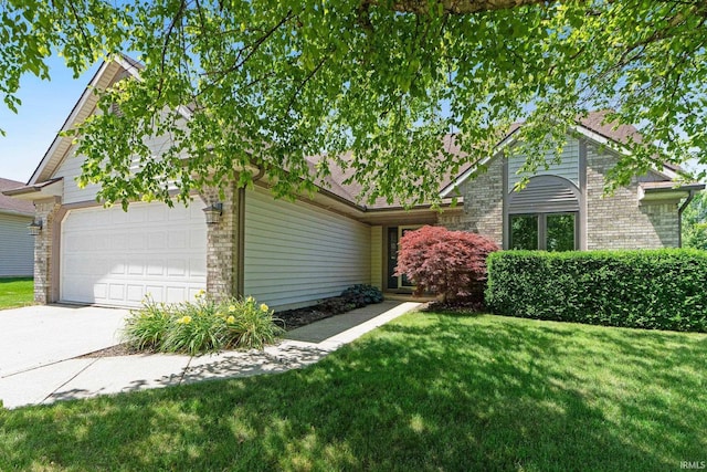 9502 Sail Wind Dr, Fort Wayne, IN 46804 - view of front of house featuring a front lawn, a garage, and brick siding