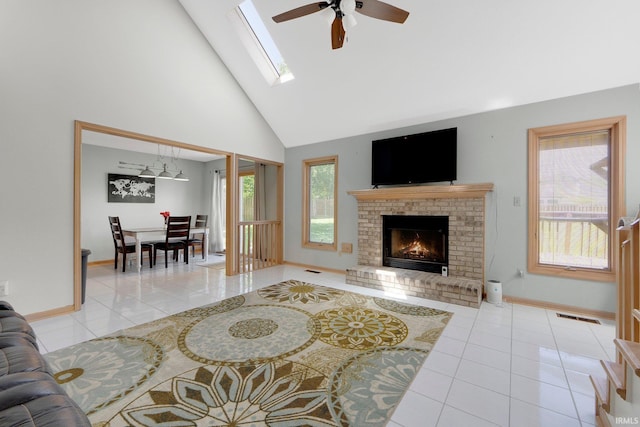 9502 Sail Wind Dr, Fort Wayne, IN 46804 - living area with tile patterned floors, high vaulted ceiling, ceiling fan, and a brick fireplace