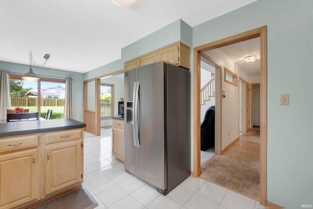 9502 Sail Wind Dr, Fort Wayne, IN 46804 - kitchen with stainless steel fridge, light brown cabinets, and dark countertops