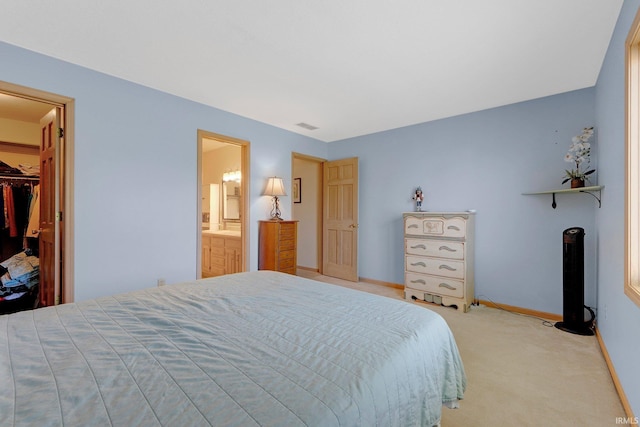 9502 Sail Wind Dr, Fort Wayne, IN 46804 - bedroom featuring light colored carpet, a walk in closet, and a closet