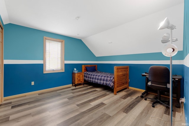 9502 Sail Wind Dr, Fort Wayne, IN 46804 - bedroom featuring vaulted ceiling and wood finished floors