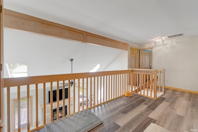 9502 Sail Wind Dr, Fort Wayne, IN 46804 - hall featuring wood finished floors and an upstairs landing