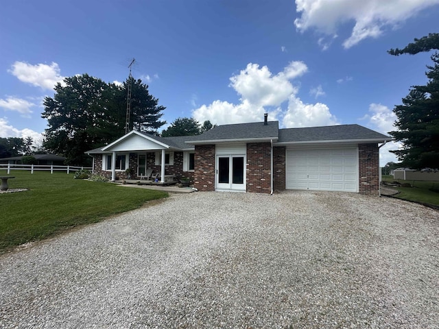4813 N Old State Road 37, Springville, IN 47462 - ranch-style home with gravel driveway, an attached garage, brick siding, a porch, and a shingled roof