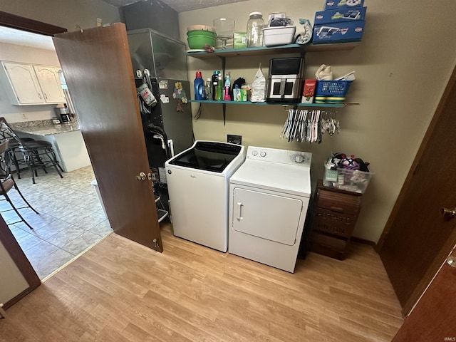 4813 N Old State Road 37, Springville, IN 47462 - laundry area with washing machine and clothes dryer and light wood finished floors