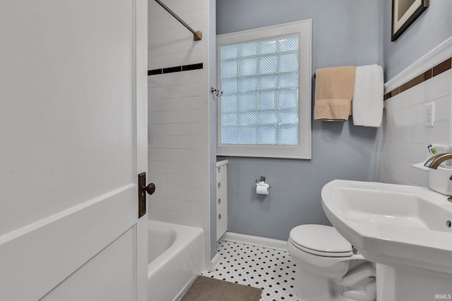 4721 Carrollton Ave, Indianapolis, IN 46205 - bathroom with baseboards and tub / shower combination
