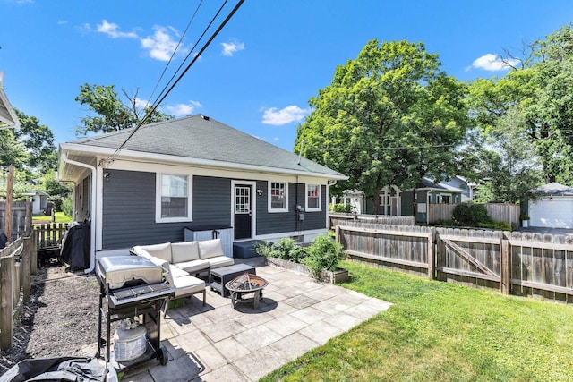 4721 Carrollton Ave, Indianapolis, IN 46205 - back of house featuring a patio area, a fenced backyard, an outdoor living space with a fire pit, and roof with shingles