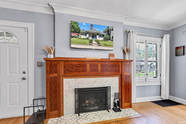 4721 Carrollton Ave, Indianapolis, IN 46205 - living area with ornamental molding, wood finished floors, and a fireplace with flush hearth