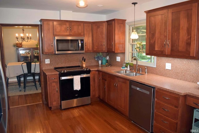 2020 N Red Bank Rd, Evansville, IN 47720 - kitchen featuring appliances with stainless steel finishes, wood finished floors, and decorative backsplash