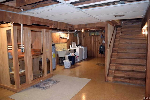 2020 N Red Bank Rd, Evansville, IN 47720 - finished below grade area with washing machine and clothes dryer, stairway, water heater, and wood walls