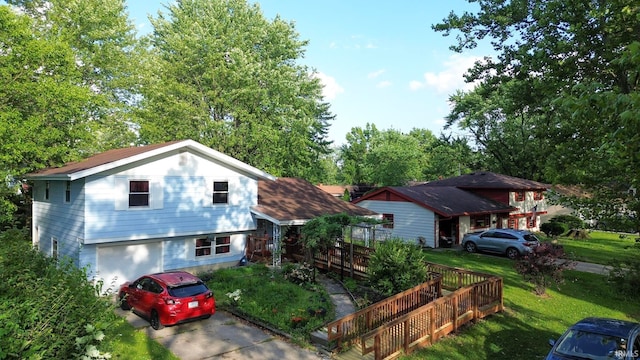 4409 Austin Dr, Fort Wayne, IN 46806 - split level home featuring an attached garage, driveway, and a front lawn