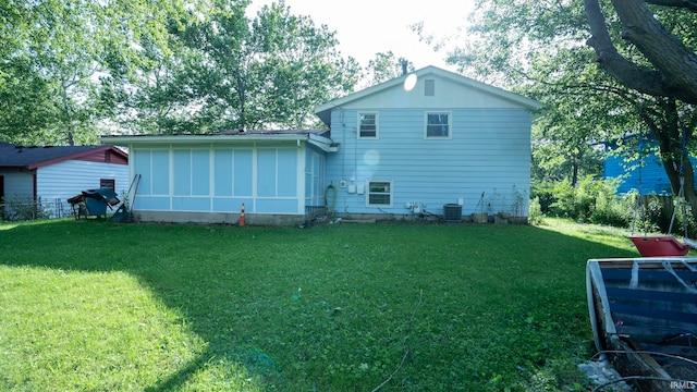 4409 Austin Dr, Fort Wayne, IN 46806 - rear view of property with a yard