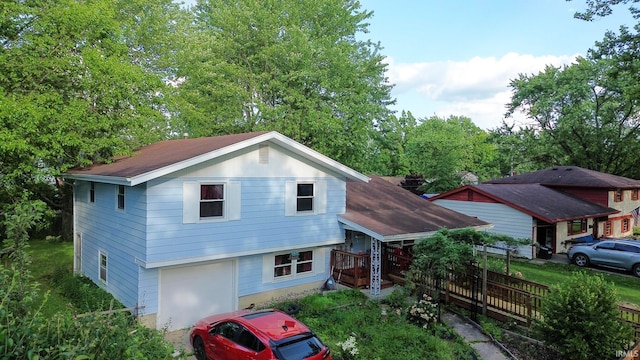 4409 Austin Dr, Fort Wayne, IN 46806 - split level home with an attached garage and a shingled roof