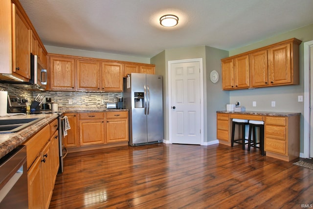 3517 Boulder Pass, Fort Wayne, IN 46818 - kitchen with stainless steel appliances, decorative backsplash, dark wood-type flooring, and stone countertops