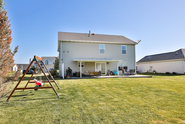 3517 Boulder Pass, Fort Wayne, IN 46818 - back of property featuring an outdoor living space, a playground, a patio, and a lawn