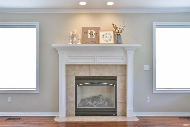 3517 Boulder Pass, Fort Wayne, IN 46818 - detailed view of wood finished floors, ornamental molding, recessed lighting, and a tiled fireplace
