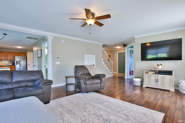 3517 Boulder Pass, Fort Wayne, IN 46818 - living room featuring dark wood finished floors, a ceiling fan, ornamental molding, and stairway