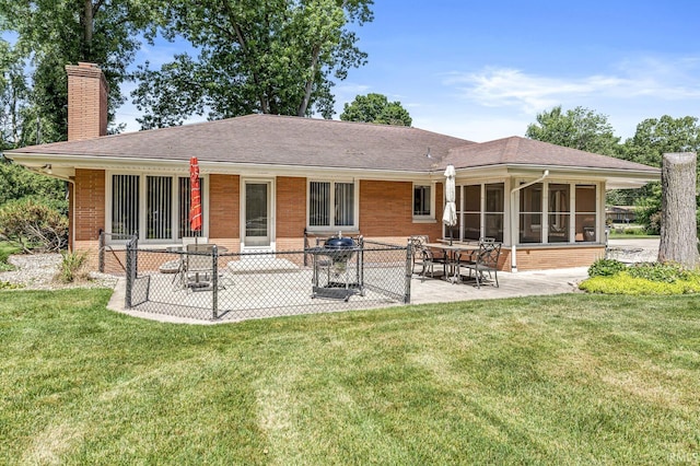 56928 County Road 13, Elkhart, IN 46516 - rear view of house with a chimney, a yard, a patio area, and roof with shingles