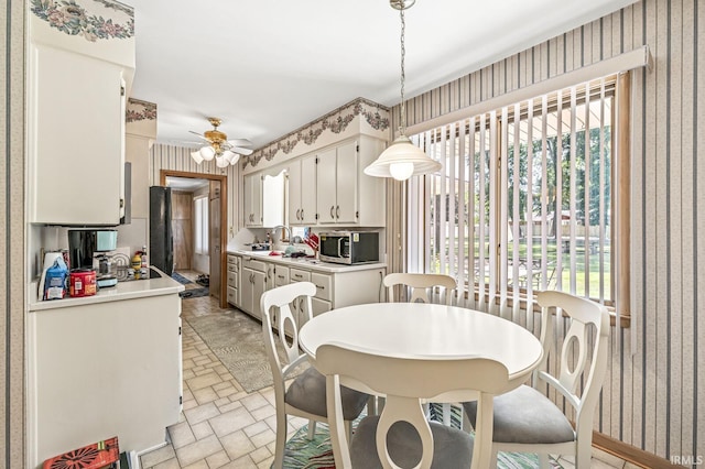 56928 County Road 13, Elkhart, IN 46516 - dining area featuring wallpapered walls and ceiling fan