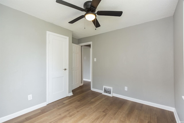 717 S Falcon St, South Bend, IN 46619 - unfurnished bedroom with light wood-type flooring and a ceiling fan