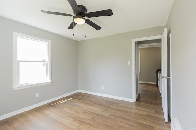 717 S Falcon St, South Bend, IN 46619 - spare room featuring light wood-style flooring and a ceiling fan