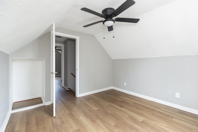 717 S Falcon St, South Bend, IN 46619 - additional living space with wood finished floors, lofted ceiling, and a ceiling fan