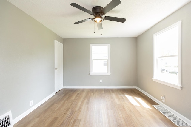 717 S Falcon St, South Bend, IN 46619 - empty room with light wood-style flooring and ceiling fan