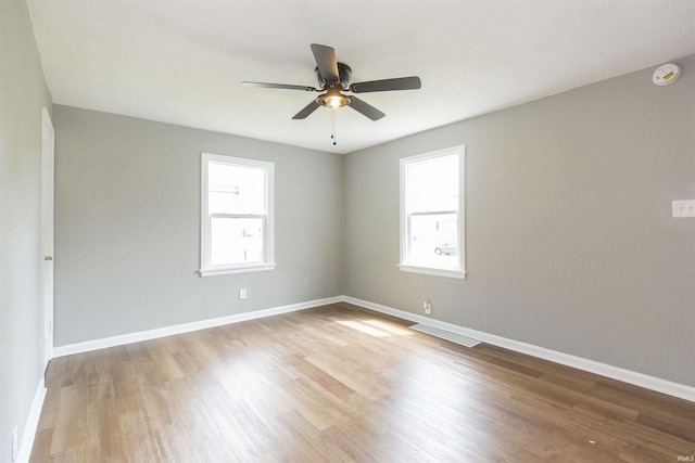 717 S Falcon St, South Bend, IN 46619 - unfurnished room with wood finished floors, ceiling fan, and a smoke detector