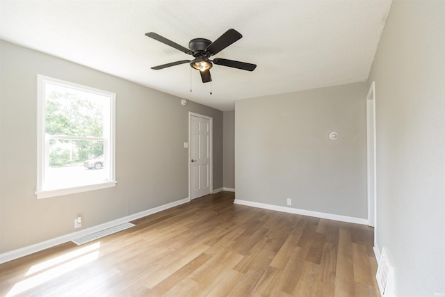717 S Falcon St, South Bend, IN 46619 - unfurnished room with light wood-type flooring and a ceiling fan