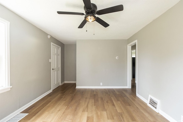 717 S Falcon St, South Bend, IN 46619 - unfurnished room featuring ceiling fan, wood finished floors, and a smoke detector
