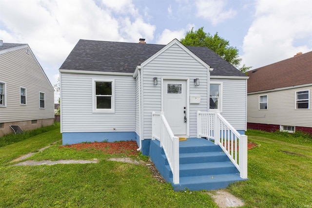 717 S Falcon St, South Bend, IN 46619 - view of front facade featuring a front yard and roof with shingles