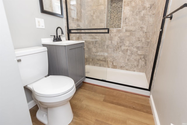717 S Falcon St, South Bend, IN 46619 - full bath featuring a tile shower, vanity, and wood finished floors