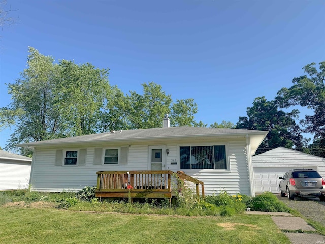 310 Corwin Ln, Fort Wayne, IN 46816 - single story home with a front lawn, a chimney, and a detached garage